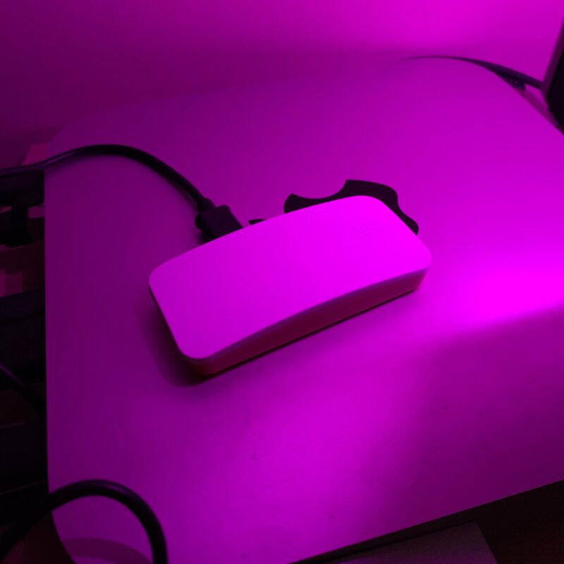 gremlin, a Raspberry Pi Zero 2 W glowing under pink desk light, cables attached